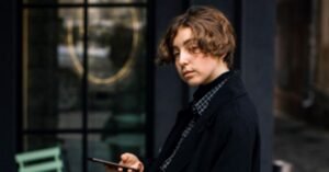 Sleek and Stylish hairstyle featuring center part and wavy threads on sides is an expression of boldness and rebellion spirit 