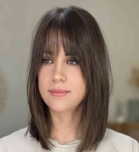 The baby bangs hairstyle has a bold and versatile look